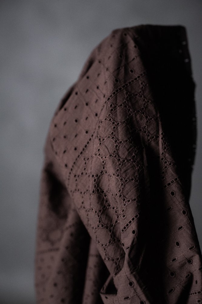 a dark rich purple eyelet embroidered cotton fabric