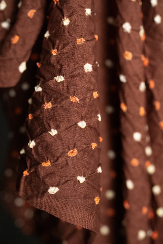 Bandhani tie-dye Indian cotton fabric in rust brown