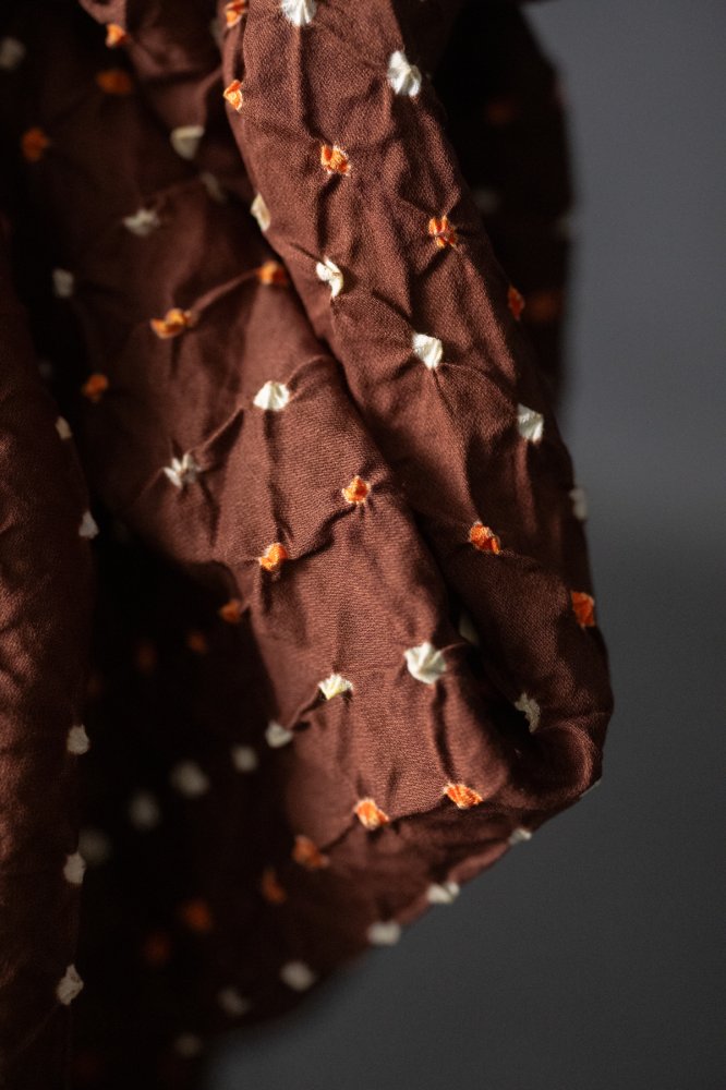 Bandhani tie-dye Indian cotton fabric in rust brown
