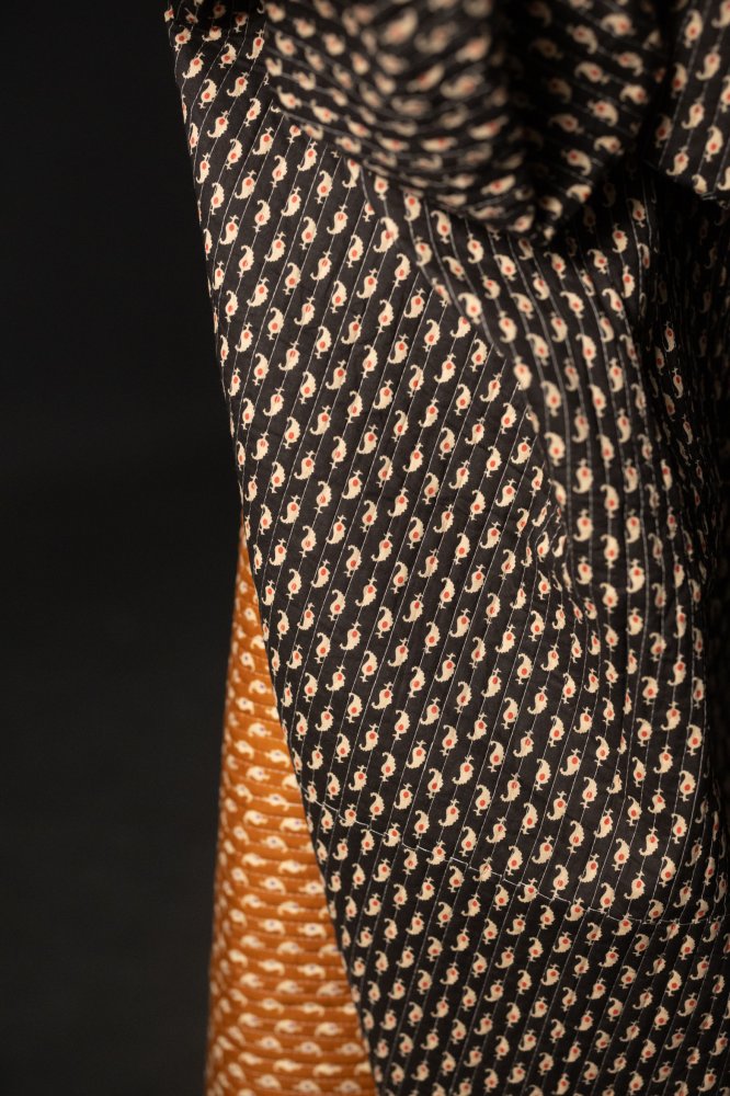 quilted black and ochre paisley indian cotton fabric