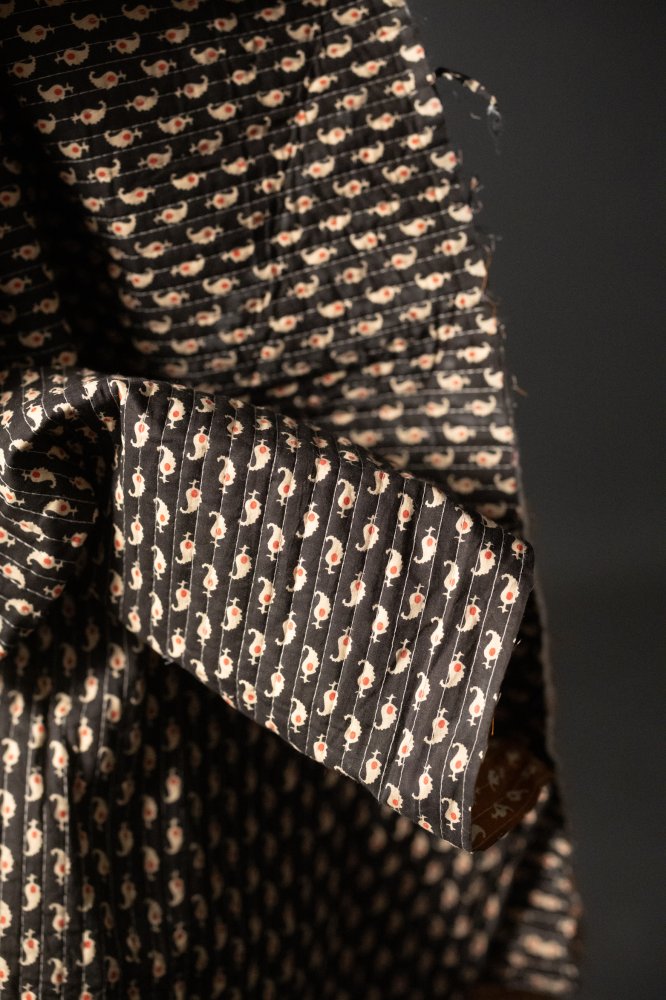 quilted black and ochre paisley indian cotton fabric