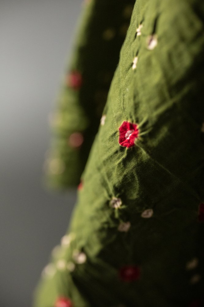 Bandhani tie-dye Indian cotton fabric in olive green