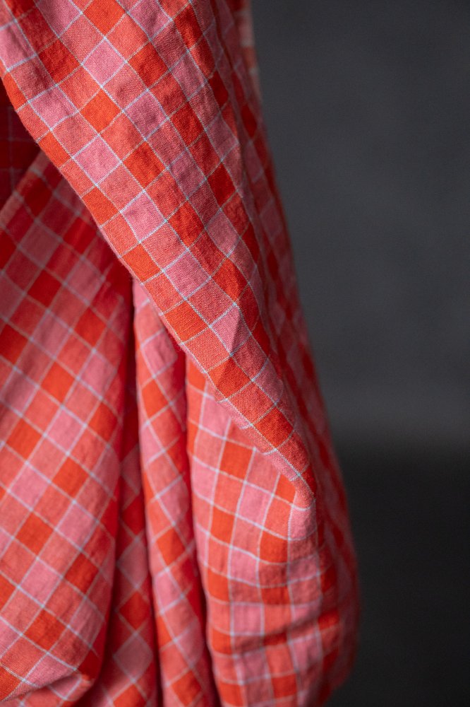 Raspberry pink and coral red with a hint of sky blue linen check fabric