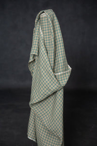 A green and pink laundered linen check fabric