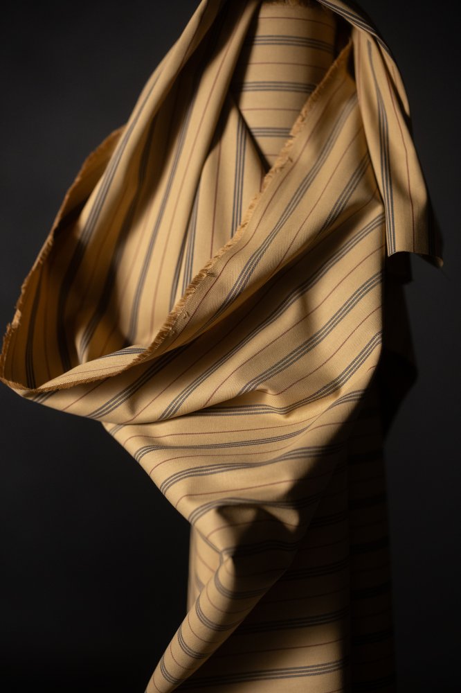 a warm tan ticking stripe fabric