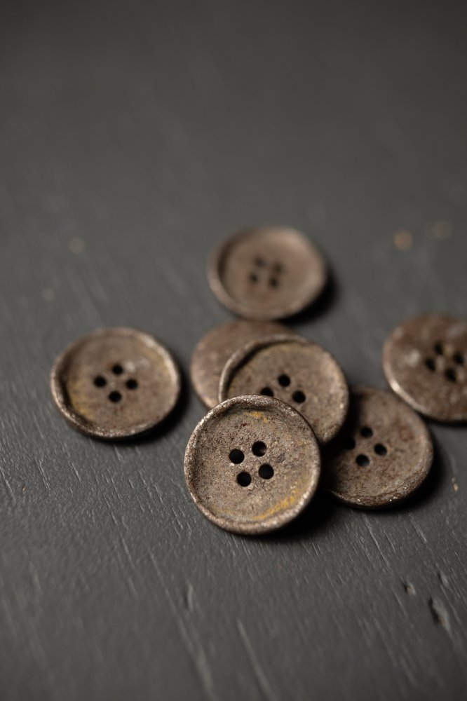 Unearthed Button