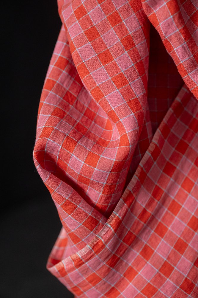 Raspberry pink and coral red with a hint of sky blue linen check fabric