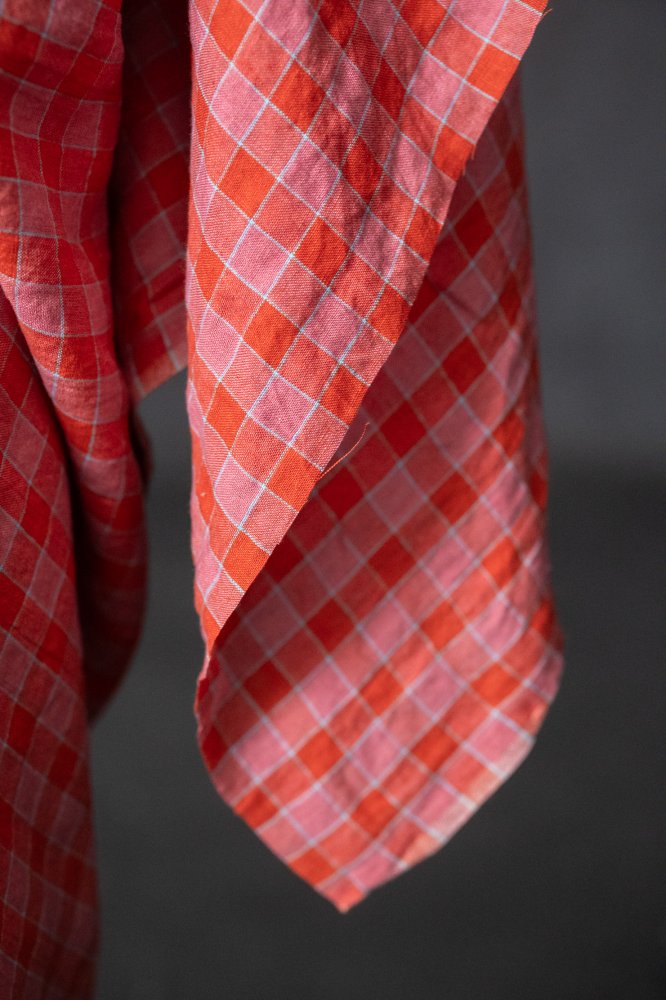 Raspberry pink and coral red with a hint of sky blue linen check fabric