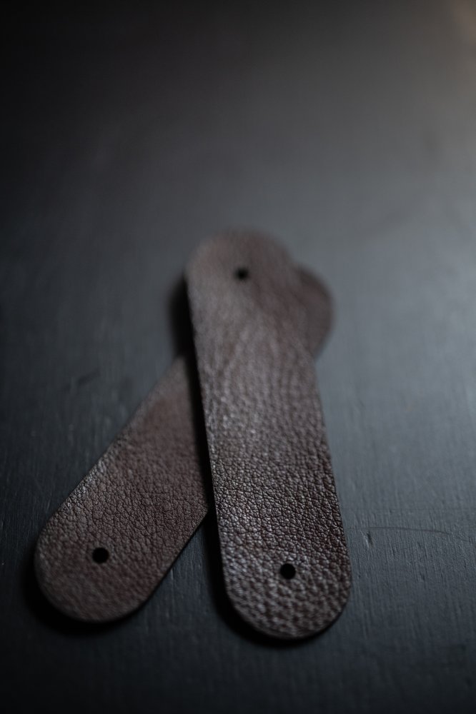 two leather tabs for bag